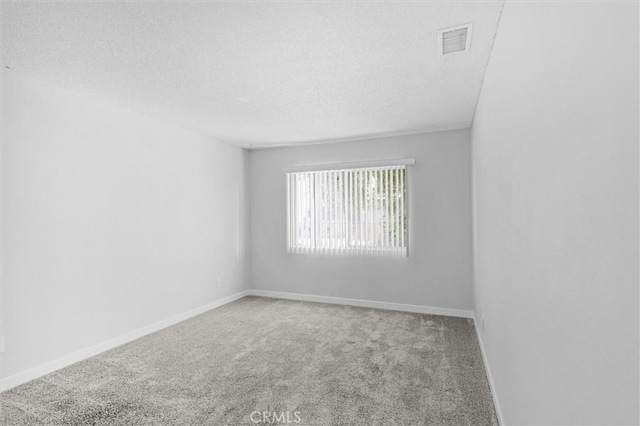 31864 Railroad Canyon Rd Unit 6 D, Canyon Lake, CA 92587 - empty room with carpet floors, a textured ceiling, and baseboards