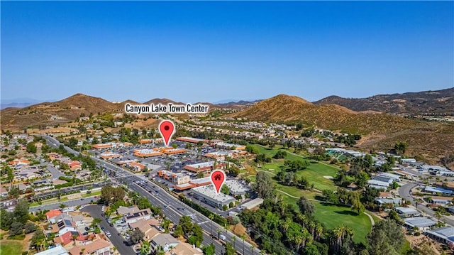 31864 Railroad Canyon Rd Unit 6 D, Canyon Lake, CA 92587 - aerial overview of property's location featuring a mountainous background, a golf club, and nearby suburban area