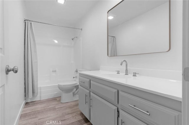 31864 Railroad Canyon Rd Unit 6 D, Canyon Lake, CA 92587 - full bathroom with vanity, shower / bath combo with shower curtain, toilet, and wood finished floors