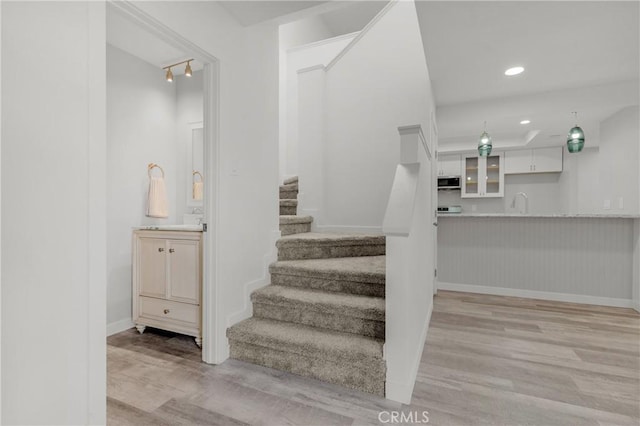 31864 Railroad Canyon Rd Unit 6 D, Canyon Lake, CA 92587 - staircase with wood finished floors, baseboards, and recessed lighting