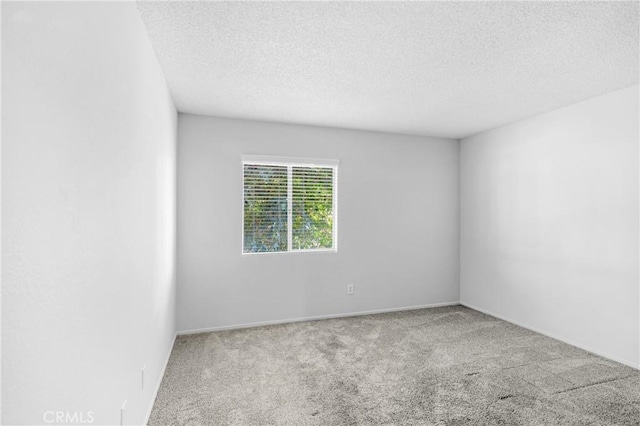 31864 Railroad Canyon Rd Unit 6 D, Canyon Lake, CA 92587 - spare room featuring carpet floors, a textured ceiling, and baseboards