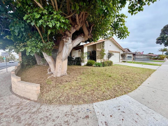 1431 Holly Ave, Oxnard, CA 93036 - view of front of house with concrete driveway, a garage, and a front lawn