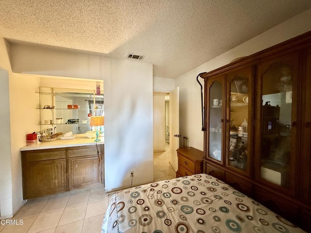 1431 Holly Ave, Oxnard, CA 93036 - bedroom featuring light tile patterned floors and a textured ceiling