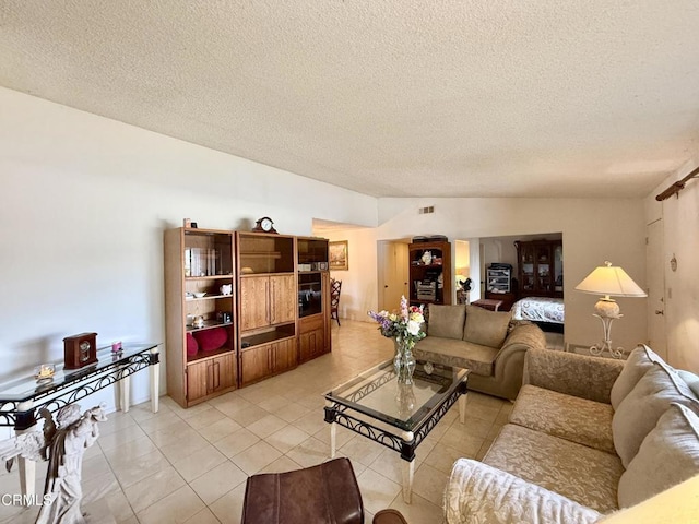1431 Holly Ave, Oxnard, CA 93036 - living area featuring a textured ceiling and light tile patterned flooring
