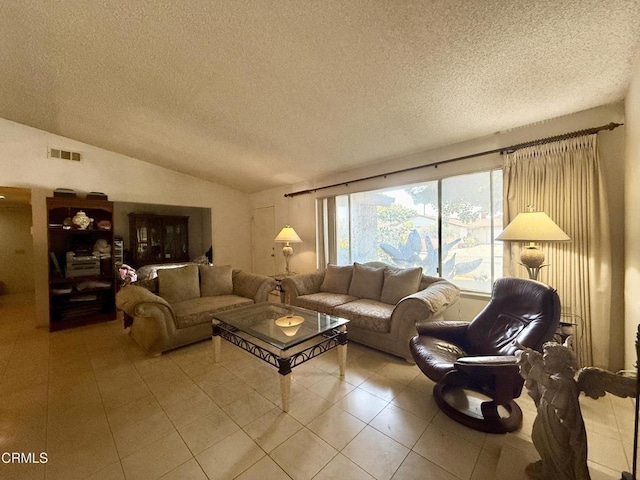 1431 Holly Ave, Oxnard, CA 93036 - living room featuring a textured ceiling, light tile patterned floors, and lofted ceiling