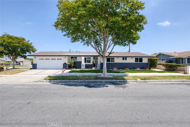 14752 Donegal Dr, Garden Grove, CA 92844 - single story home featuring an attached garage, concrete driveway, and a front yard