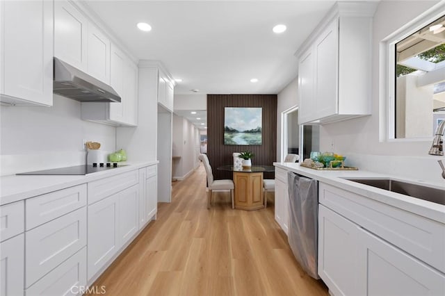 14752 Donegal Dr, Garden Grove, CA 92844 - kitchen featuring under cabinet range hood, dishwasher, black electric stovetop, a sink, and light wood-style flooring