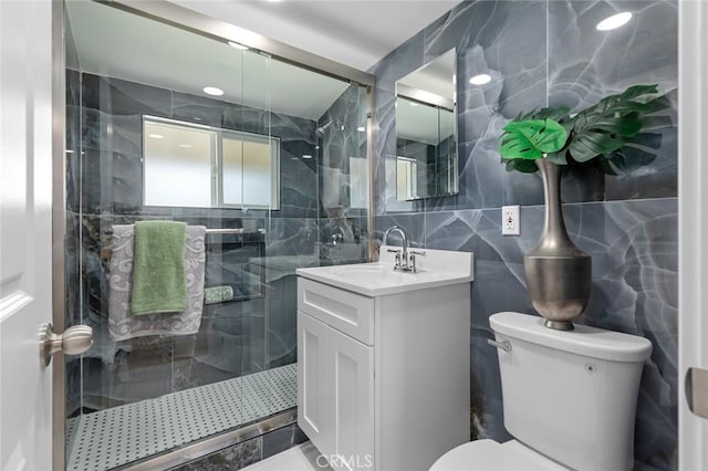 14752 Donegal Dr, Garden Grove, CA 92844 - bathroom with tile walls, toilet, vanity, a shower stall, and backsplash