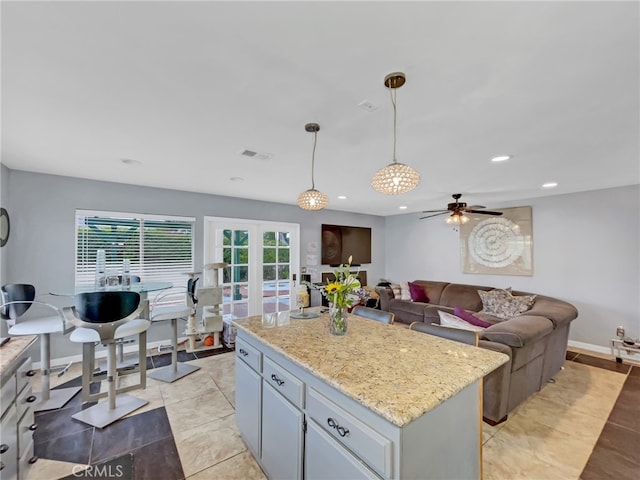 51 Rolling Hills Dr, Phillips Ranch, CA 91766 - kitchen featuring pendant lighting, recessed lighting, a center island, a ceiling fan, and open floor plan