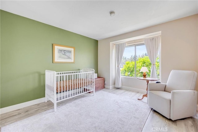 53 Briarwood Ln Unit 81, Aliso Viejo, CA 92656 - bedroom with wood finished floors and a nursery area