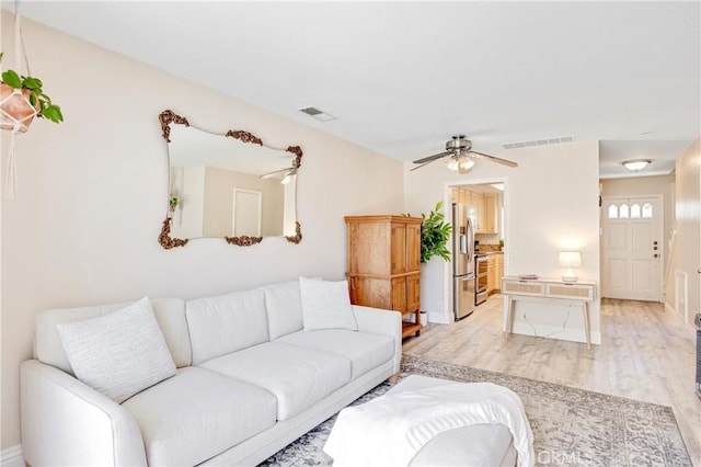 53 Briarwood Ln Unit 81, Aliso Viejo, CA 92656 - living area featuring light wood-style flooring and ceiling fan