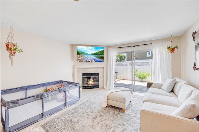 53 Briarwood Ln Unit 81, Aliso Viejo, CA 92656 - living room featuring wood finished floors and a fireplace with flush hearth