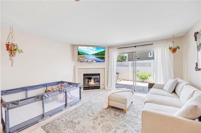 53 Briarwood Ln Unit 81, Aliso Viejo, CA 92656 - living room featuring wood finished floors and a fireplace with flush hearth
