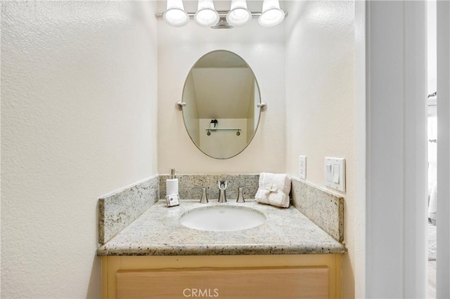 53 Briarwood Ln Unit 81, Aliso Viejo, CA 92656 - bathroom featuring vanity and a textured wall