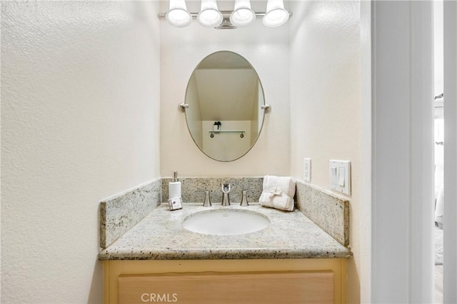 53 Briarwood Ln Unit 81, Aliso Viejo, CA 92656 - bathroom featuring vanity and a textured wall