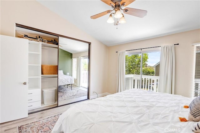 53 Briarwood Ln Unit 81, Aliso Viejo, CA 92656 - bedroom with wood finished floors, access to exterior, multiple windows, lofted ceiling, and ceiling fan