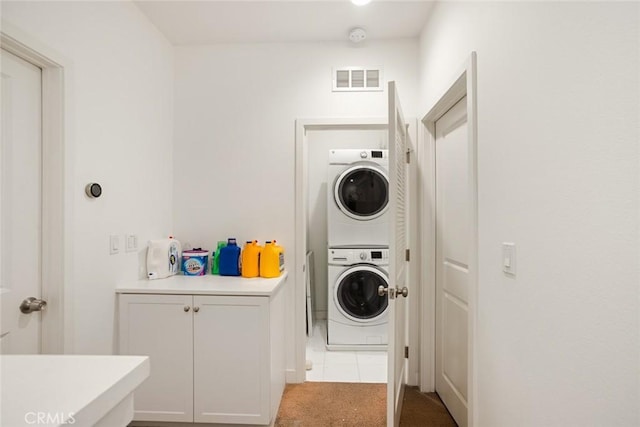 7679 Sunflower Dr, Pico Rivera, CA 90660 - laundry room featuring estacked washer and dryer and carpet