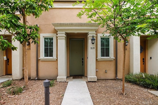 7679 Sunflower Dr, Pico Rivera, CA 90660 - view of exterior entry featuring stucco siding