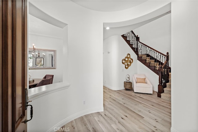 4 Dennis Ln, Ladera Ranch, CA 92694 - hall with wood finished floors, a chandelier, stairway, and baseboards