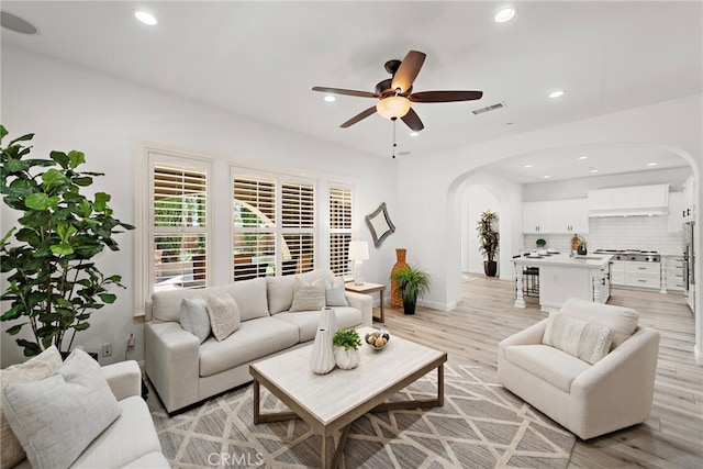 4 Dennis Ln, Ladera Ranch, CA 92694 - living area with arched walkways, a ceiling fan, light wood-type flooring, and recessed lighting