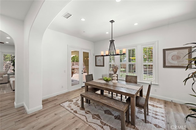 4 Dennis Ln, Ladera Ranch, CA 92694 - dining space featuring arched walkways, healthy amount of natural light, light wood-style flooring, and recessed lighting