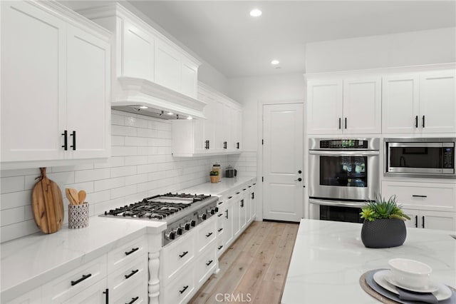 4 Dennis Ln, Ladera Ranch, CA 92694 - kitchen with appliances with stainless steel finishes, white cabinets, recessed lighting, and backsplash