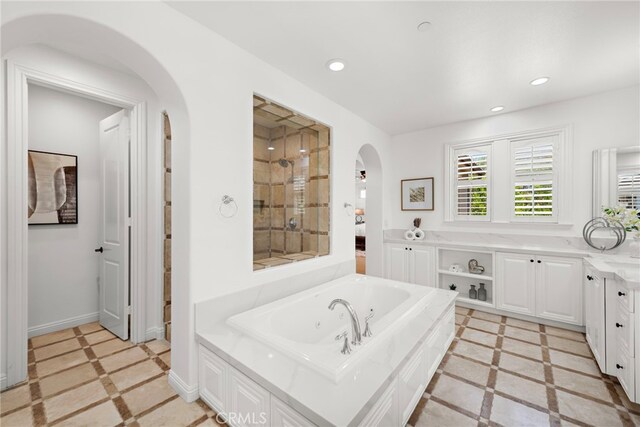 4 Dennis Ln, Ladera Ranch, CA 92694 - full bathroom featuring a whirlpool tub, inlaid floor details, recessed lighting, and baseboards