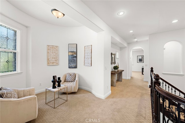 4 Dennis Ln, Ladera Ranch, CA 92694 - living area featuring light colored carpet, arched walkways, recessed lighting, and baseboards
