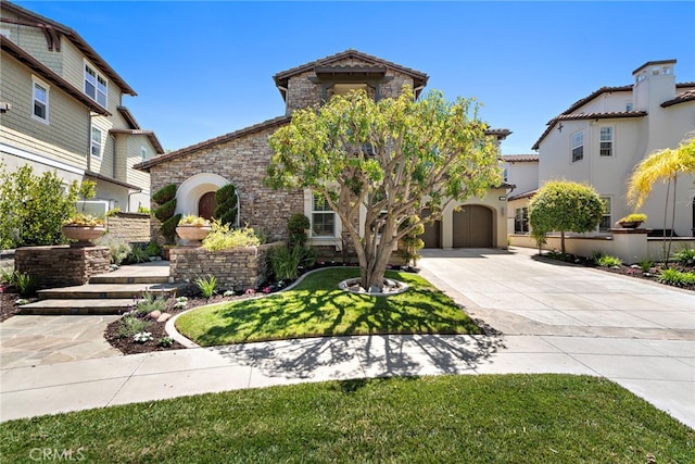 4 Dennis Ln, Ladera Ranch, CA 92694 - view of front of house with stone siding, concrete driveway, a garage, and a front yard