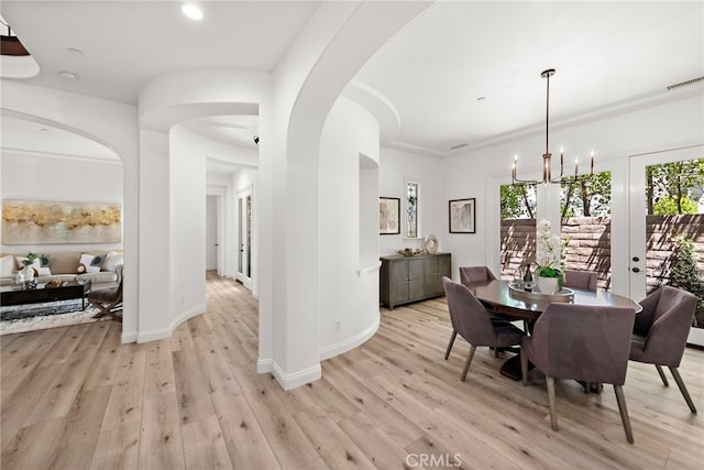 4 Dennis Ln, Ladera Ranch, CA 92694 - dining area featuring arched walkways, light wood-style floors, and recessed lighting