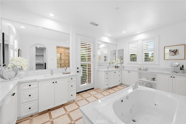 4 Dennis Ln, Ladera Ranch, CA 92694 - bathroom featuring recessed lighting, a tub with jets, vanity, and a closet