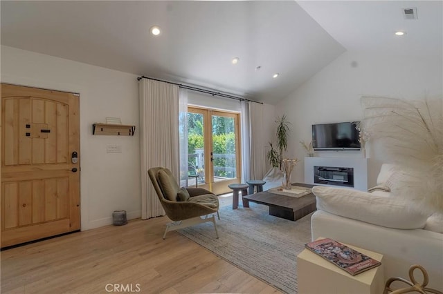 11101 Blix St, Toluca Lake, CA 91602 - living room featuring light wood-style floors, vaulted ceiling, and recessed lighting