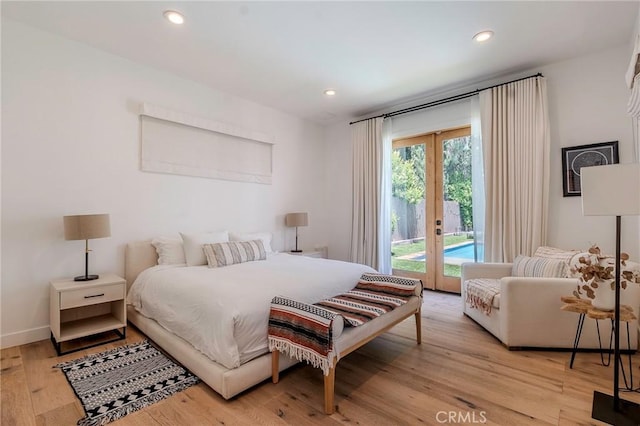 11101 Blix St, Toluca Lake, CA 91602 - bedroom featuring access to outside, light wood-type flooring, recessed lighting, and french doors