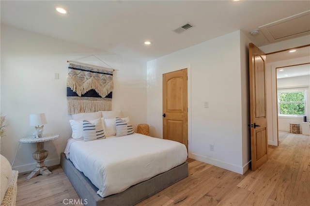 11101 Blix St, Toluca Lake, CA 91602 - bedroom with light wood finished floors, recessed lighting, and attic access