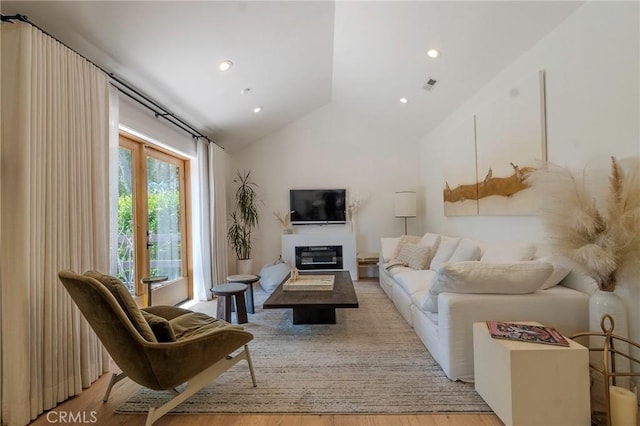 11101 Blix St, Toluca Lake, CA 91602 - living area with vaulted ceiling, light wood-style floors, and recessed lighting