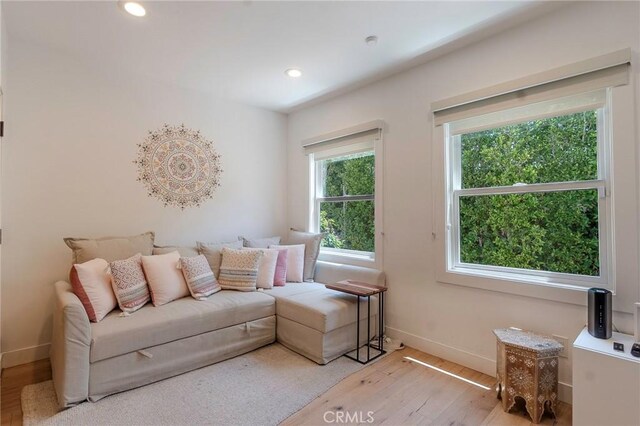 11101 Blix St, Toluca Lake, CA 91602 - living area with light wood-style flooring and recessed lighting