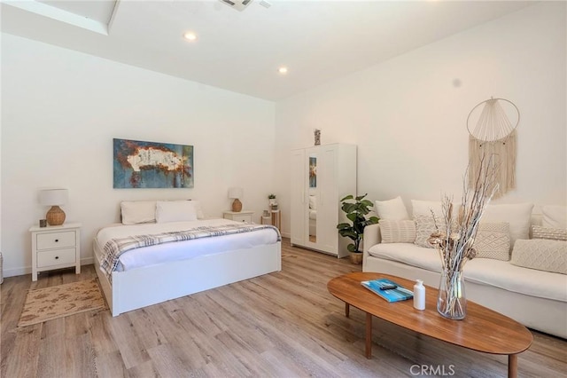11101 Blix St, Toluca Lake, CA 91602 - bedroom with light wood finished floors and recessed lighting
