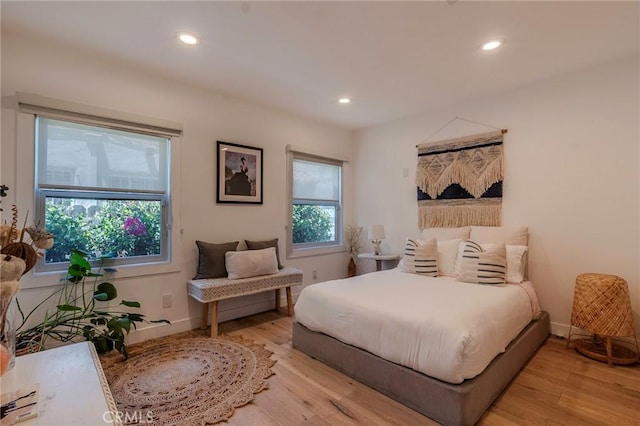 11101 Blix St, Toluca Lake, CA 91602 - bedroom with light wood-type flooring and recessed lighting
