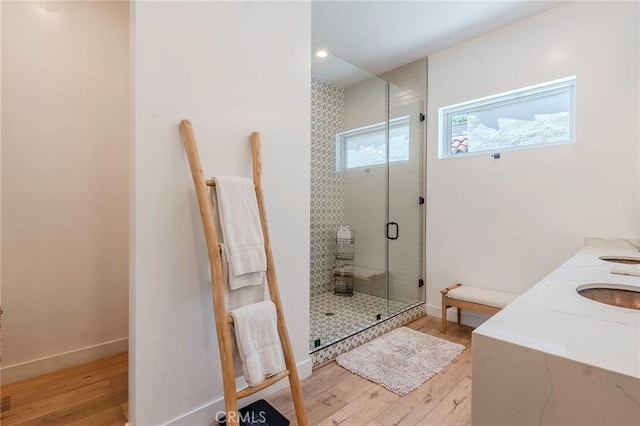 11101 Blix St, Toluca Lake, CA 91602 - full bath featuring wood finished floors, a shower stall, and double vanity