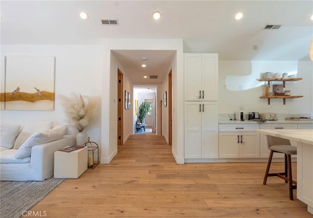 11101 Blix St, Toluca Lake, CA 91602 - corridor with light wood-style flooring and recessed lighting