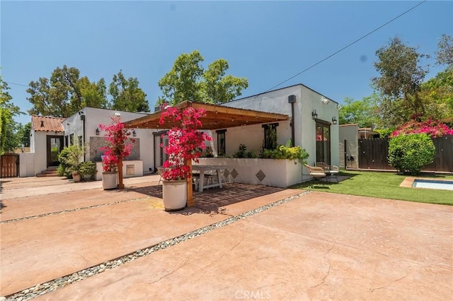 11101 Blix St, Toluca Lake, CA 91602 - view of front facade with a patio area, stucco siding, and a gazebo