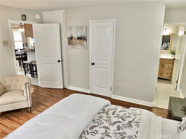 1039 E Appleton St Unit 2, Long Beach, CA 90802 - bedroom featuring wood finished floors, baseboards, and ensuite bathroom
