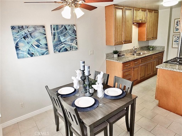 1039 E Appleton St Unit 2, Long Beach, CA 90802 - dining area with ceiling fan, baseboards, and light tile patterned flooring