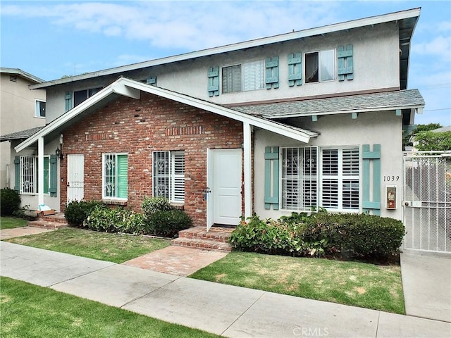 1039 E Appleton St Unit 2, Long Beach, CA 90802 - view of front of house featuring stucco siding, brick siding, and roof with shingles