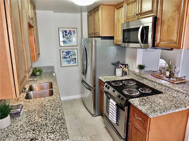 1039 E Appleton St Unit 2, Long Beach, CA 90802 - kitchen featuring stainless steel microwave, range with electric cooktop, a sink, light stone counters, and light tile patterned floors