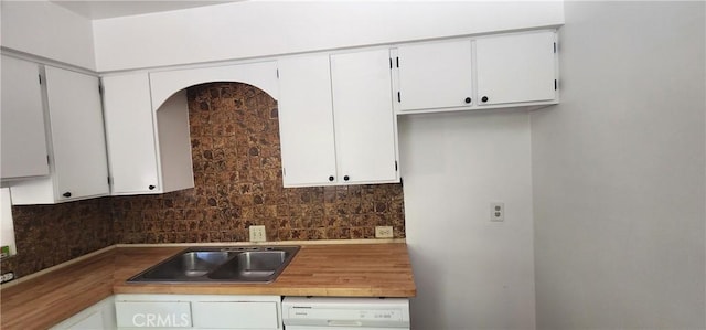 5580 Traffic Way Unit 3, Atascadero, CA 93422 - kitchen featuring backsplash, dishwashing machine, and white cabinets
