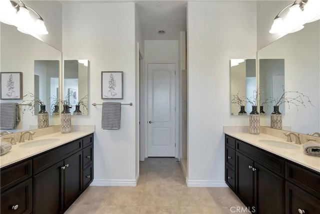 13691 Cobalt Ct, Rancho Cucamonga, CA 91739 - bathroom with two vanities, baseboards, and tile patterned flooring