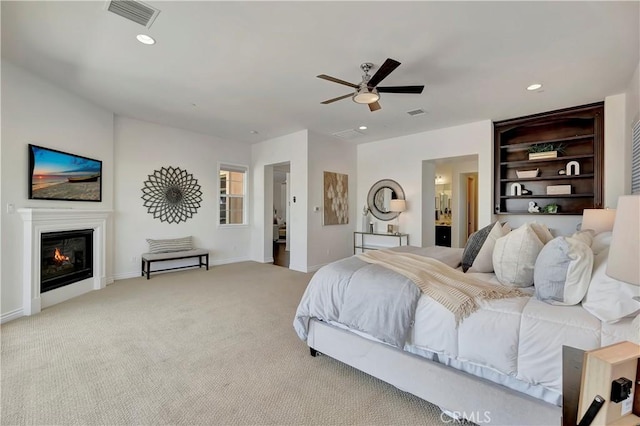 13691 Cobalt Ct, Rancho Cucamonga, CA 91739 - carpeted bedroom with baseboards, recessed lighting, a glass covered fireplace, a ceiling fan, and ensuite bathroom