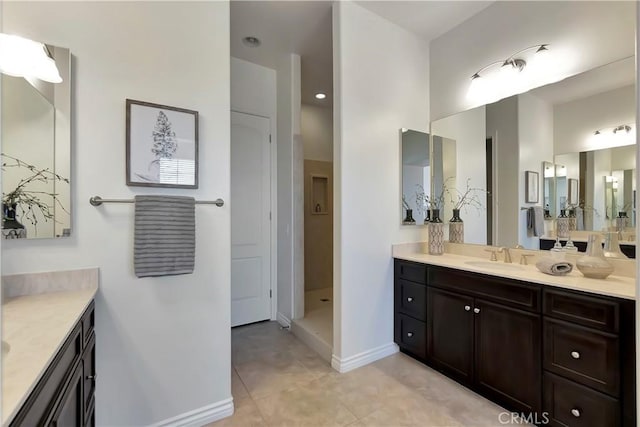 13691 Cobalt Ct, Rancho Cucamonga, CA 91739 - bathroom with two vanities, tile patterned floors, and baseboards