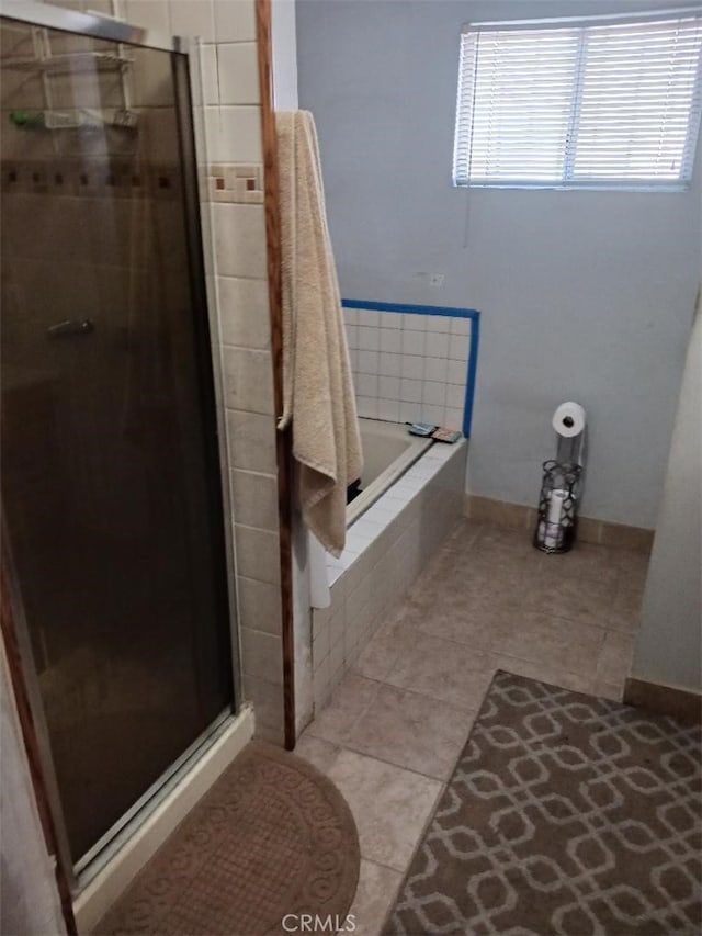 5155 W 104th St, Inglewood, CA 90304 - bathroom featuring a stall shower, a relaxing tiled tub, tile patterned flooring, and baseboards
